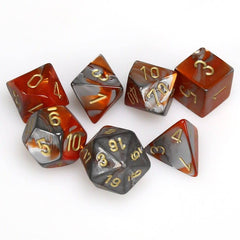 Set of polyhedral dice with red, silver, and gold numbers on a white background | Tacoma Games